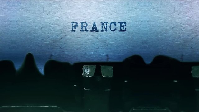 France Word closeup Being Typing and Centered on a Sheet of paper on old vintage Typewriter mechanical 4k Footage Background Animation.