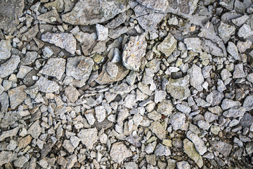 background of broken old gray plaster, construction debris