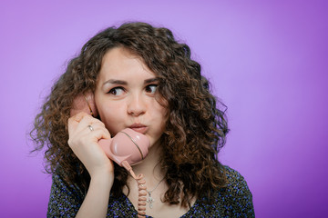 Woman Talking On Landline Telephone, Indoors