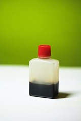 Soy sauce in white small plastic bottle