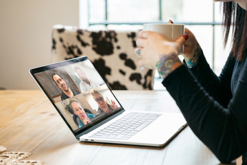 Staying Home: Woman With Coffee In Virtual Work Meeting