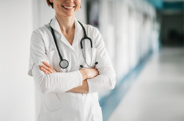 Unrecognizable woman doctor standing in hospital. Copy space.