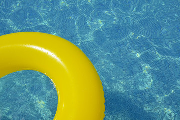 Colorful inflatable tube floating in swimming pool