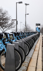 row of parked bicycles in the city