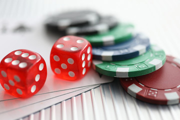 Close up on table are dice chips playing cards. Possibility relaxation, emotional relaxation in casino. Complex game combinations and tasks. Games develop logical thinking and memory