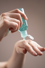 Covering your hands with alcohol-based hand gel, a concept to prevent the spread of coronavirus.
