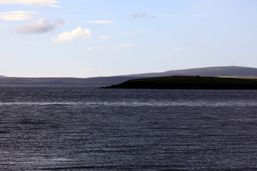 Fototapeta na wymiar Scapa Flow - Orkney (Scotland), UK - August 07, 2018: Landscape near harbour of Scapa Flow, Orkney, Scotland, Highlands, United Kingdom