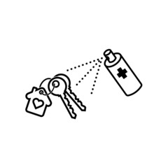 Hand spraying the alcohol spray hand sanitiser towards the house key to clean and prevent the spread of bacteria and virus.
