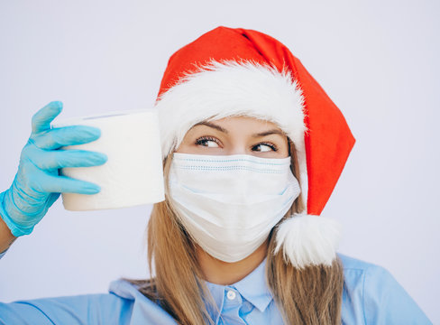 doctor with mask. Funny photo. Funny. Santa hat woman. Mask