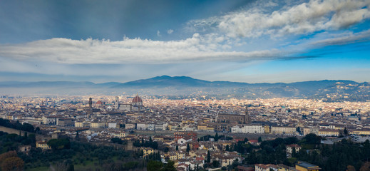 Fototapeta na wymiar Aerial panorama of Florence at sunrise, Firenze, Tuscany, Italy, cathedral, river, drone pint view, mountains is on background