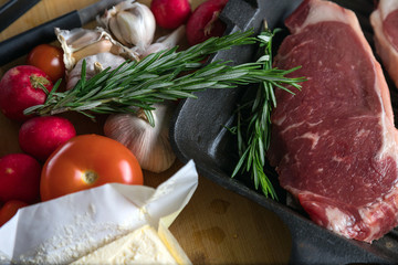 Delicious fresh beef steak. Cooking meat with vegetables. Tender fresh beef.