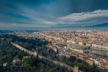 Aerial panorama of Florence at sunrise, Firenze, Tuscany, Italy, cathedral, river, drone pint view, mountains is on background