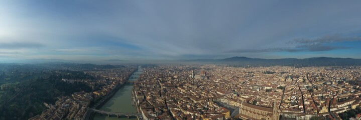 Aerial panorama of Florence at sunrise, Firenze, Tuscany, Italy, cathedral, river, drone pint view,...