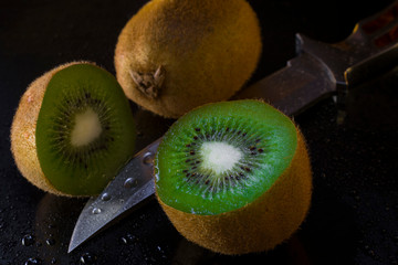 ripe kiwi on a black background