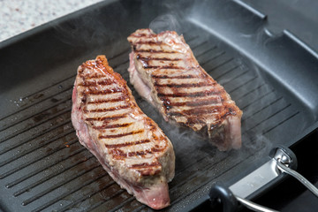 pan-fried beef steak. brown crust on the meat.