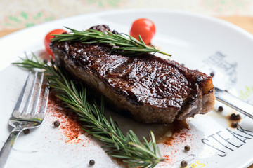 Delicious fresh steak. Juicy piece of meat. Roasted meat. The meat and vegetables.