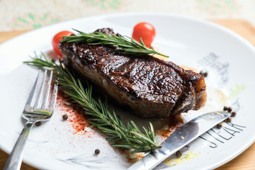 Delicious fresh steak. Juicy piece of meat. Roasted meat. The meat and vegetables.