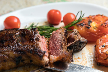 Delicious fresh steak. Juicy piece of meat. Roasted meat. The meat and vegetables.