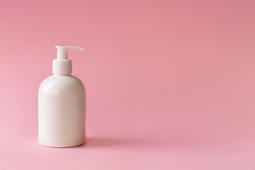 Disinfectant container, on a pink background, soap dish, for hygiene and cosmetics, copy space
