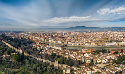 Fototapeta na wymiar Aerial panorama of Florence at sunrise, Firenze, Tuscany, Italy, cathedral, river, drone pint view, mountains is on background