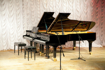 two grand pianos on the scene of musical school