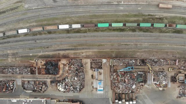orting and recycling of metal waste top view. Scrap metal procurement station. Loading operations for the utilization of ferrous metals 4k.