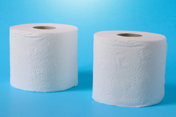 Toilet paper or tissue isolated on blue background.