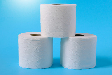 Toilet paper or tissue isolated on blue background.