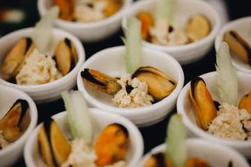 Beautifully decorated catering banquet table with different food snacks and appetizers with sandwich