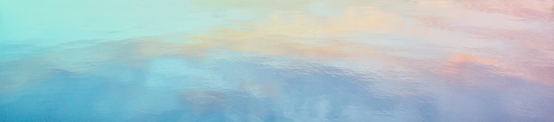 Watercolor background with peach, pink, purple, and blue tones.