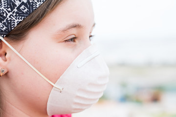 Girl in protective mask