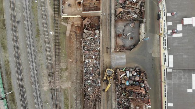 orting and recycling of metal waste top view. Scrap metal procurement station. Loading operations for the utilization of ferrous metals 4k.