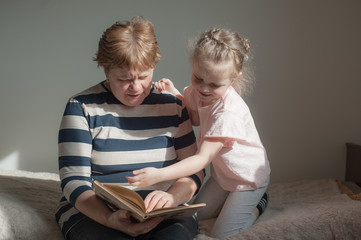 Grandmother 60 years old and granddaughter together at home. Take care of your family, stay home, coronovirus
