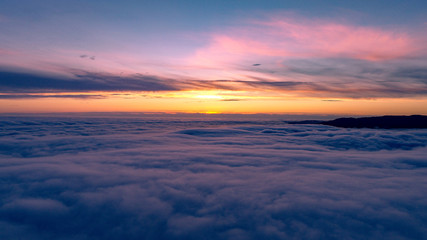 Fototapeta na wymiar Above the clouds at sunset