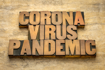 coronavirus pandemic word abstract in wood type