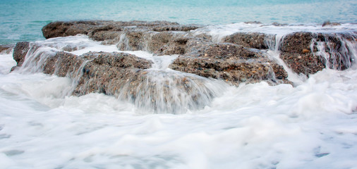Beautiful seascape.Stones, waves, foam. Вanner