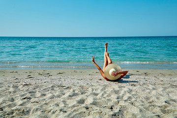 young girl happy on vacation on the beach