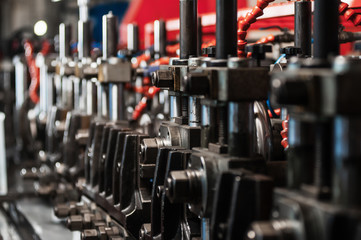 Naklejka premium Production of metal products. Pipe forming. Close up