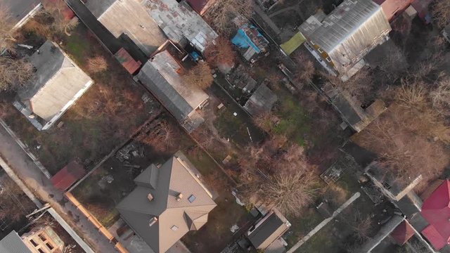 Poor houses top view aerial district overhead rotation descending down camera movement