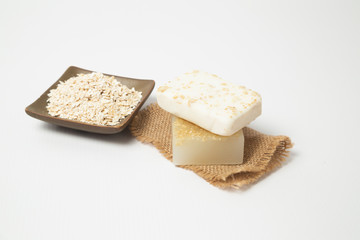 Handmade oatmeal soap on white background - organic skin care - natural spa treatments - home therapy