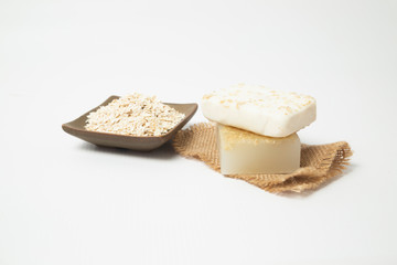 Handmade oatmeal soap on white background - organic skin care - natural spa treatments - home therapy