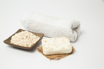 Handmade oatmeal soap on white background - organic skin care - natural spa treatments - home therapy