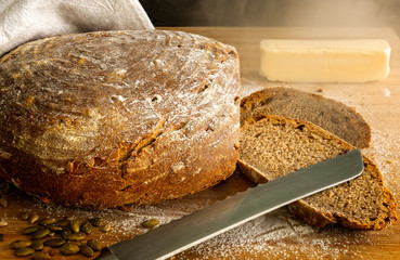 Fresh, warm homemade artisan sourdough bread, whole wheat sourdough with pumpkin and sunflower seeds