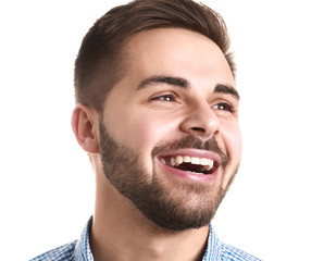 Obraz premium Handsome smiling young man on white background