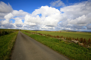 Orkney (Scotland), UK - August 08, 2018: A typical road in the Orkney islands, Orkney, Scotland, Highlands, United Kingdom