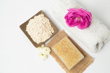 Handmade oatmeal soap on white background - organic skin care - natural spa treatments - home therapy Home spa treatment with organic oatmeal soaps - natural skin care - home therapy-top view