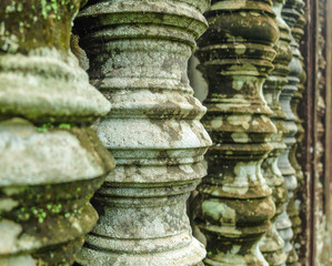 Ancient columns with moss and lichen, close up, perspective, Angkor Wat, Siem Reap, Cambodia