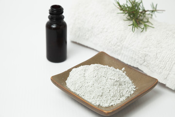 Natural spa products for skin care and treatments, green clay mask powder and natural oils - natural rosemary plant
