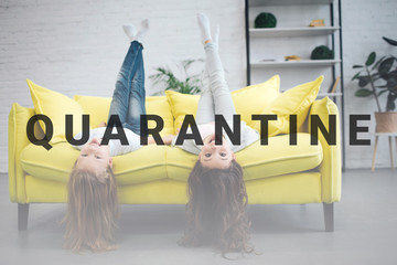 Funny young teenagers lying on yellow sofa and looking straigt on camera. They smile. Girls hold legs up in air. Their hair touch floor.