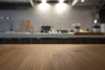 Wooden table top on blur kitchen room background. For displaying the assembly product or visual...
